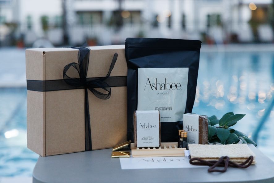 The ribboned box beside the shea butter pouch